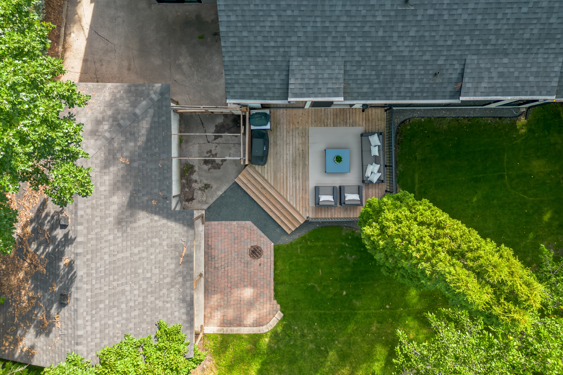 Aerial view of the rear deck, hot tub and paver patio
