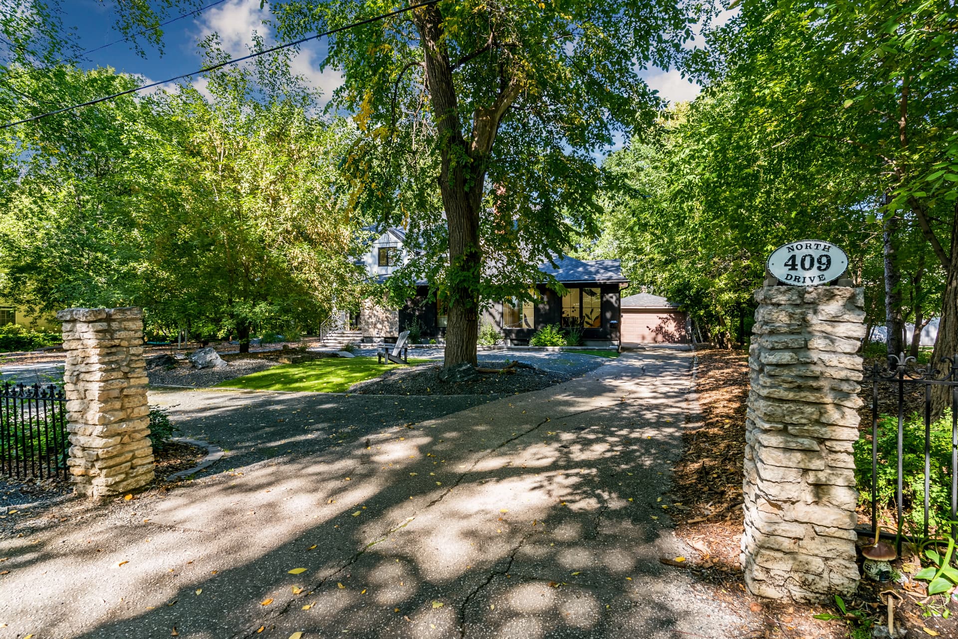 Stone gate posts marking the entrance to 409 North Drive
