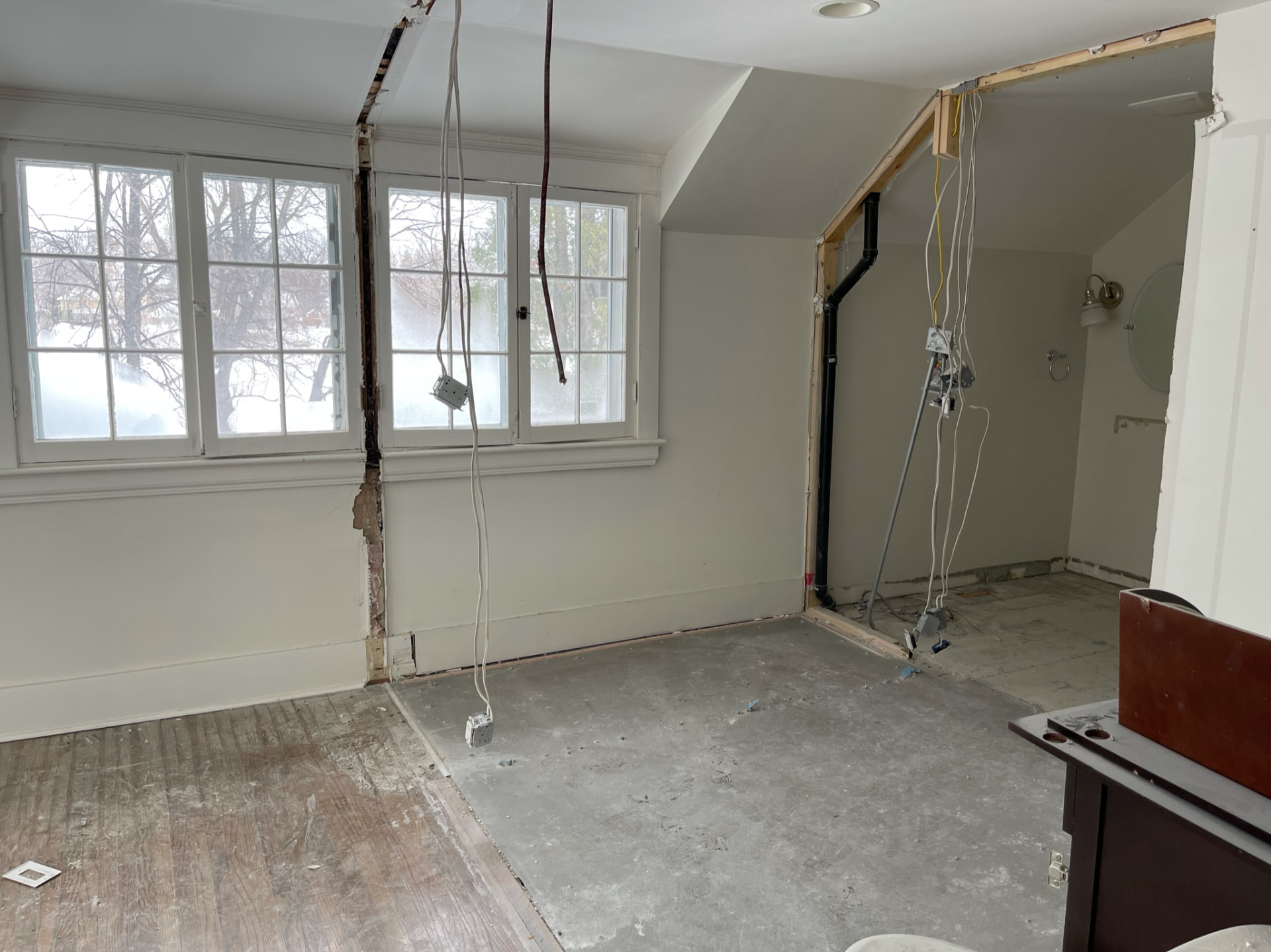 Upstairs room stripped to the studs